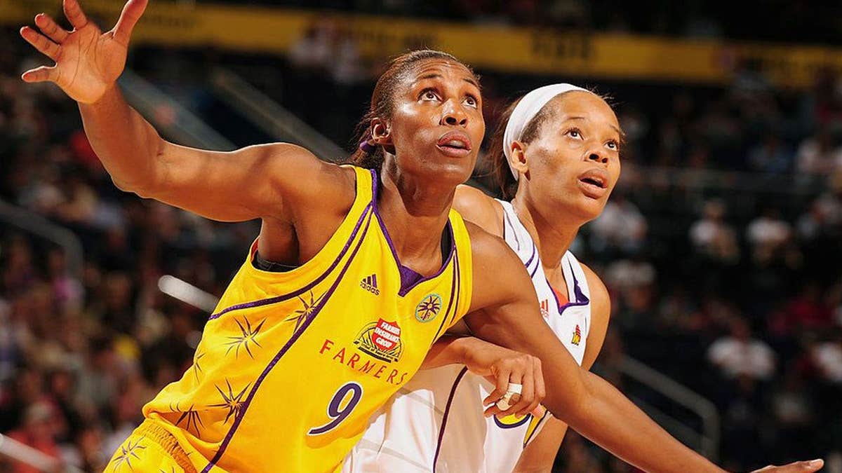 The good ol'days of the WNBA, when players like Lisa Leslie of the Los Angeles Sparks (L) seemed grateful for the opportunity to have a place to play.