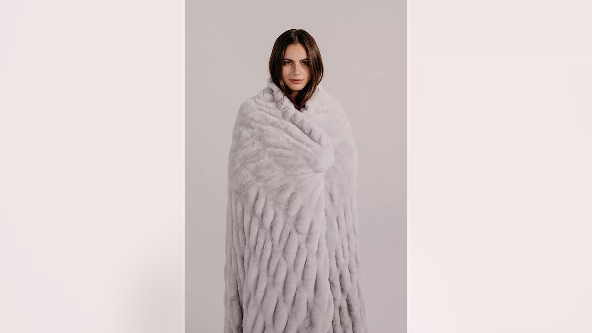 A luxurious blanket looks amazing on any piece of furniture.