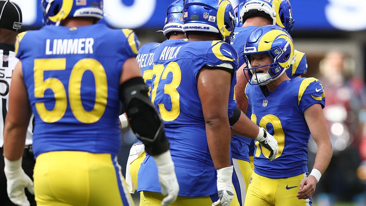 Blake Grupe celebrates with Los Angeles Rams teammates after a field goal.