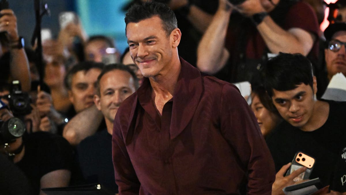 Luke Evans stands at The Housewife premiere at the Toronto International Film Festival.