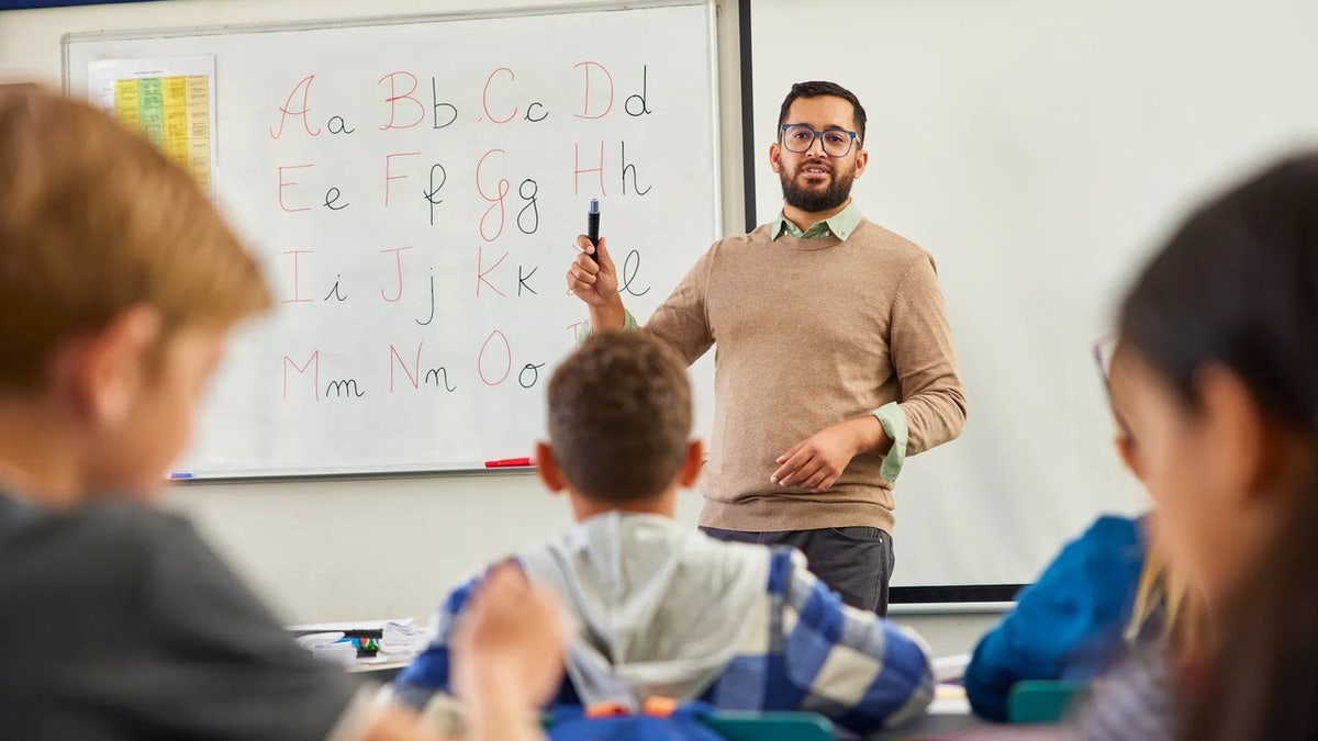 Male teacher in classroom