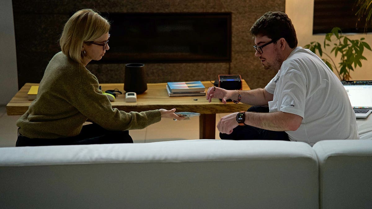 Mariana van Zeller sits with Arman during an interview.