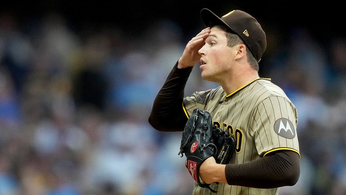 Mason Miller reacts during the ninth inning in Milwaukee.