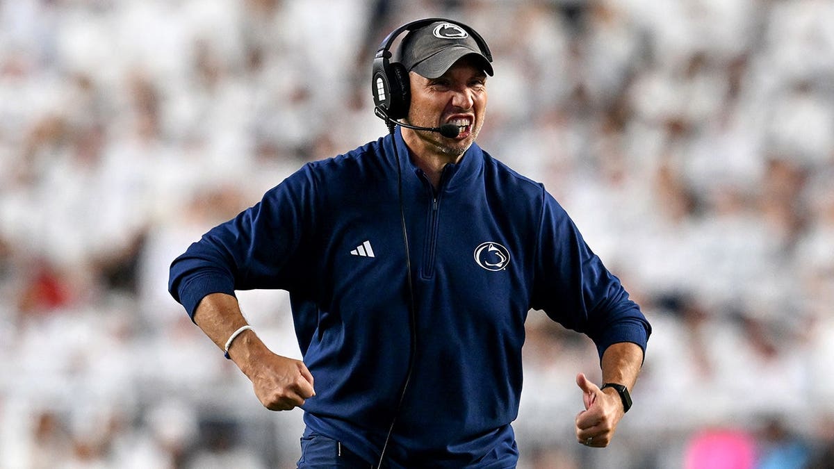 Matt Campbell reacts on the sideline during a college football game.