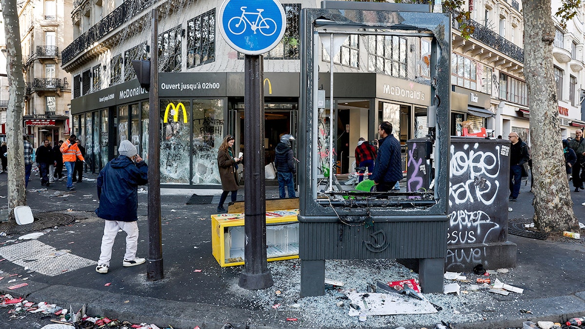 A vandalized McDonald's is shown the day after violent protests in Paris.