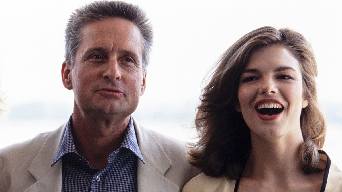 Michael Douglas and Jeanne Tripplehorn at a premiere for Basic Instinct in 1992