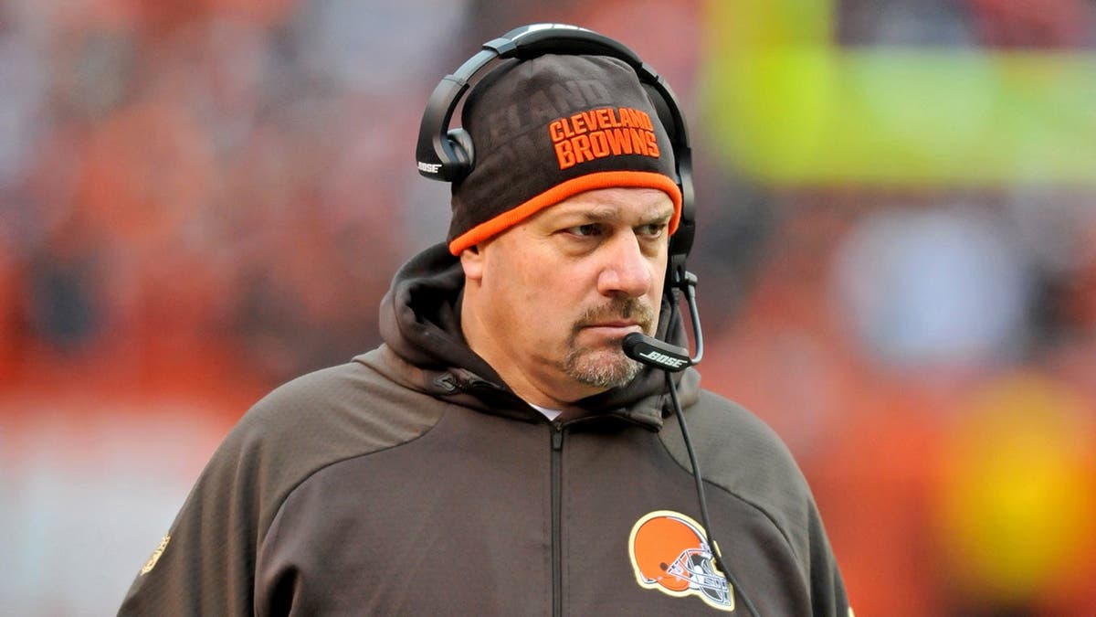 Mike Pettine stands on the sideline during a game.