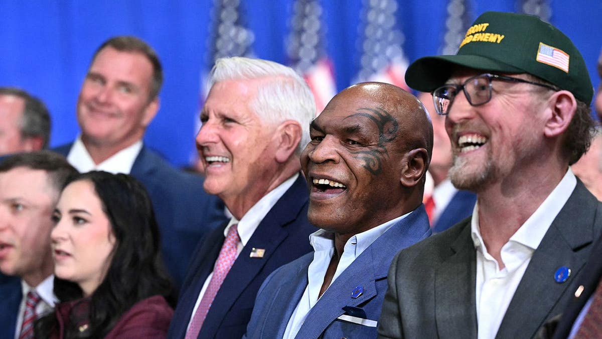 Mike Tyson reacts as Donald Trump speaks at a campaign rally in Syracuse, New York.