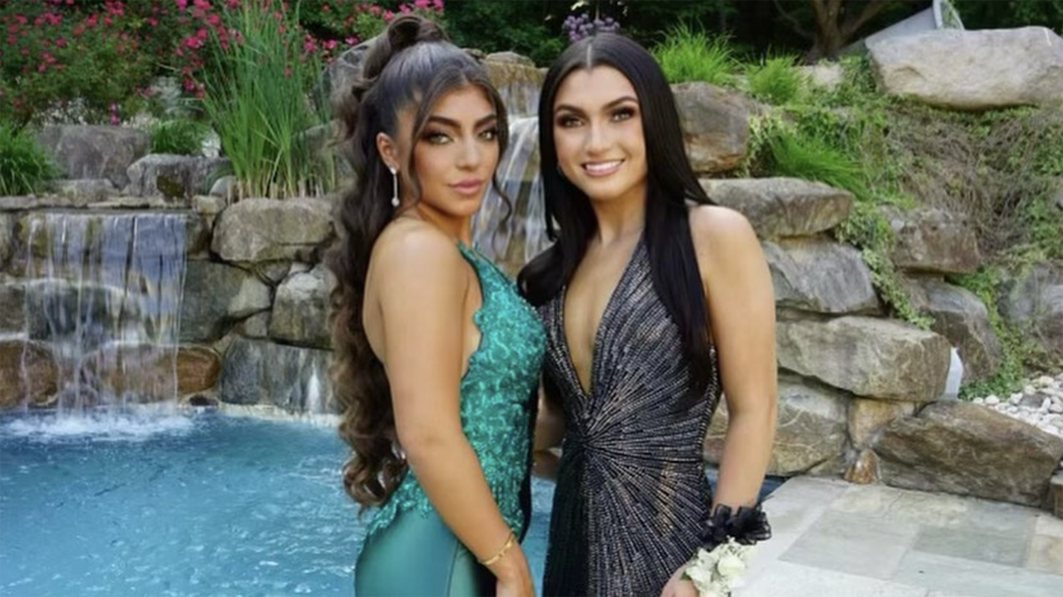 Milania and Gabriella Giudice pose together by pool