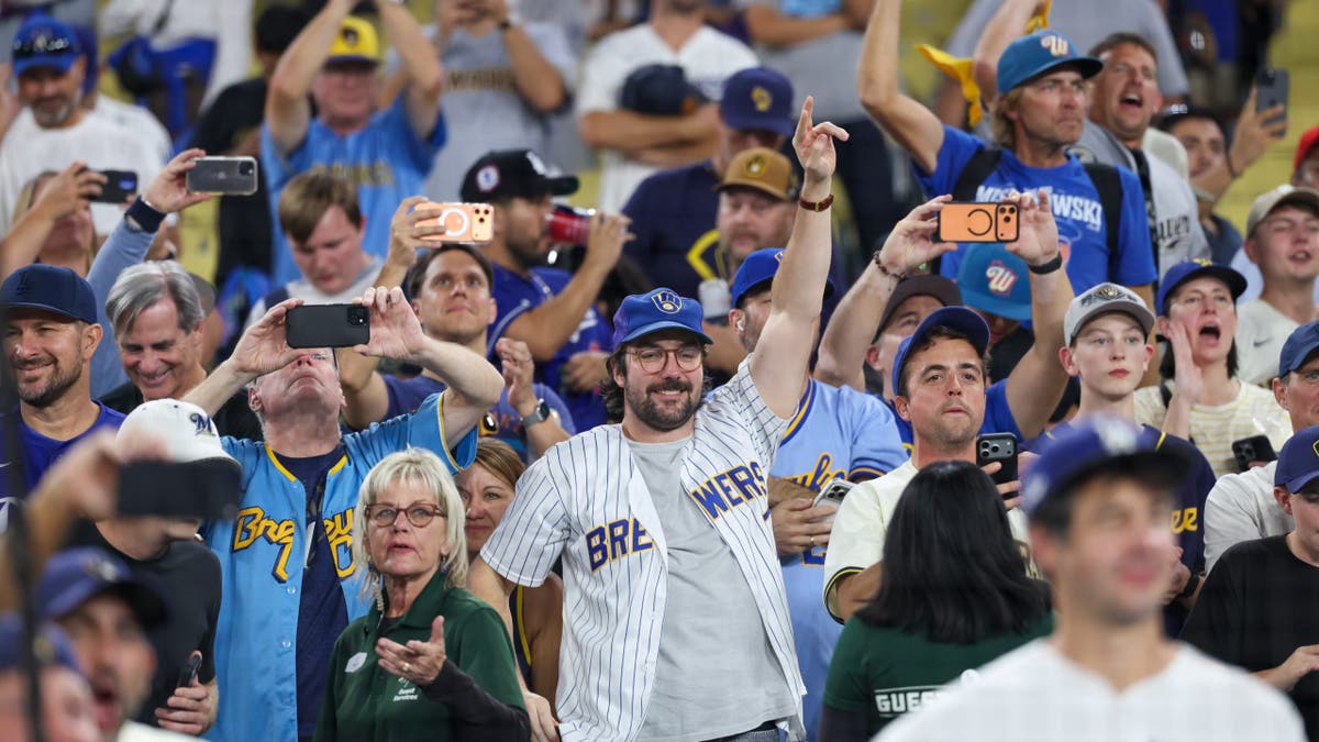 Milwaukee Brewers fans celebrate in the stands at Dodger Stadium.