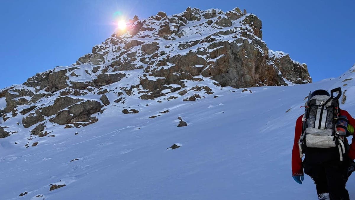 image shows hiker with backpack