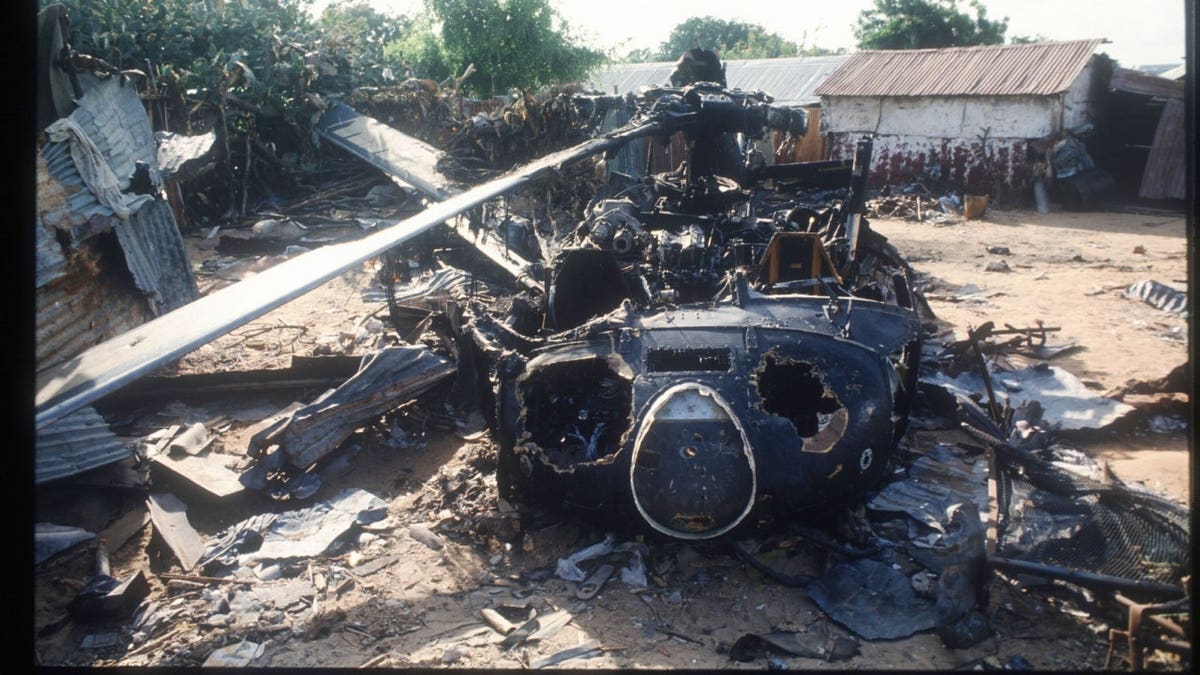 The wreckage of an American helicopter sits October 14, 1993 in Mogadishu, Somalia.