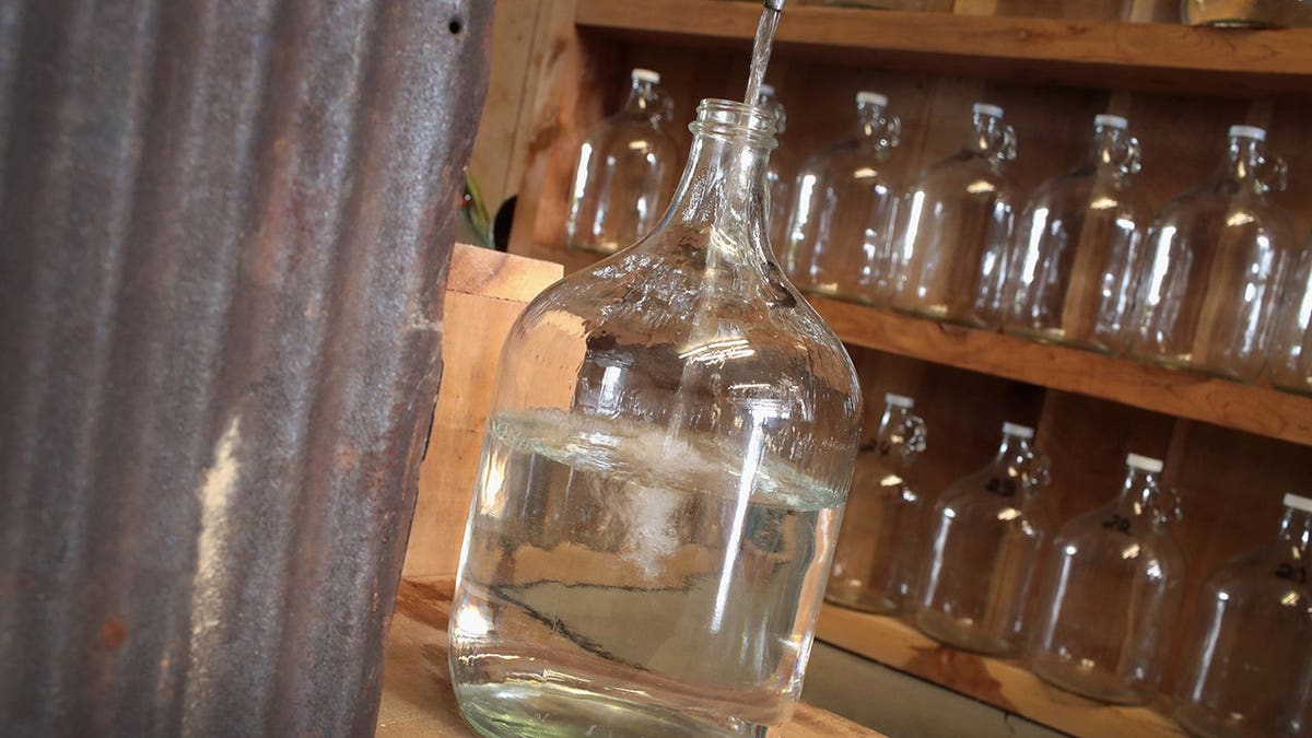 Moonshine runs from a still at Casey Jones Distillery in Hopkinsville, Ky.