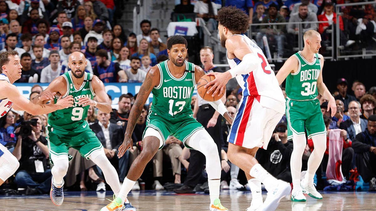 Paul George #13 of the Boston Celtics plays defense during an NBA game.