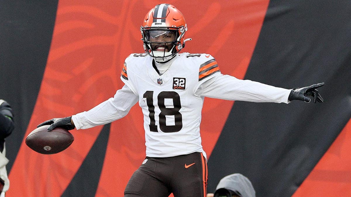 David Bell #18 celebrates after catching a touchdown pass at Paycor Stadium.