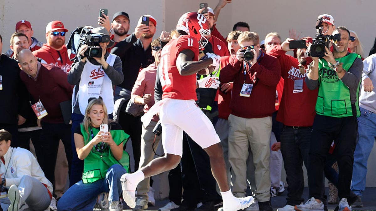 Nick Marsh steps out of bounds in the end zone during a football game.