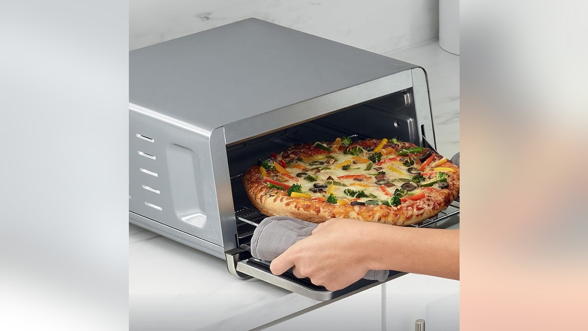 Flip up this toaster oven to save counter space.