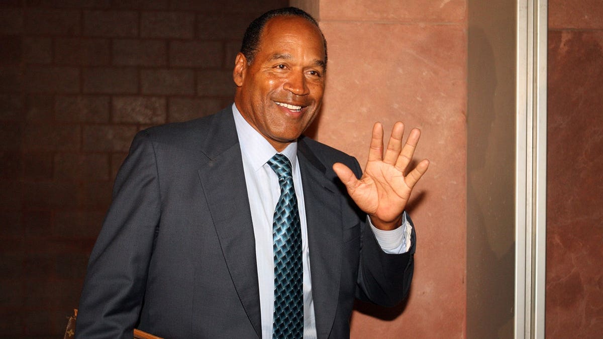 O.J. Simpson waving after leaving court in October 2008.