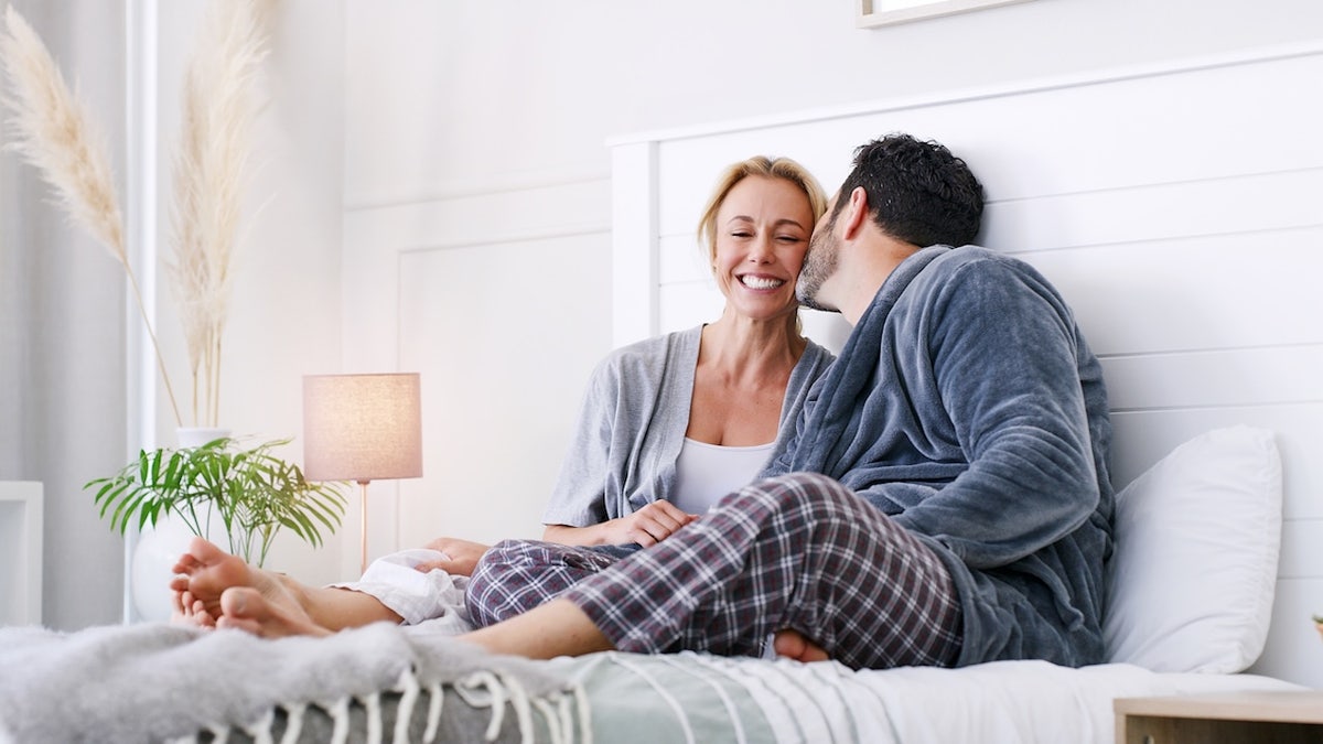 Older woman younger man in bed