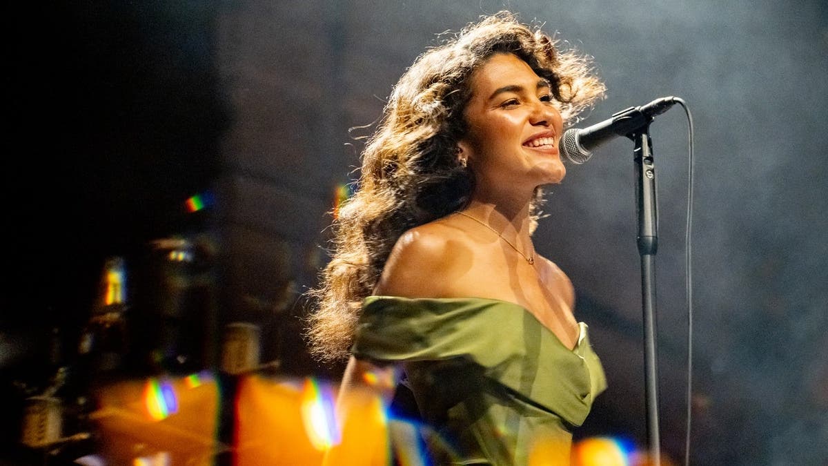 Olivia Dean performs onstage at Albert Hall in Manchester.