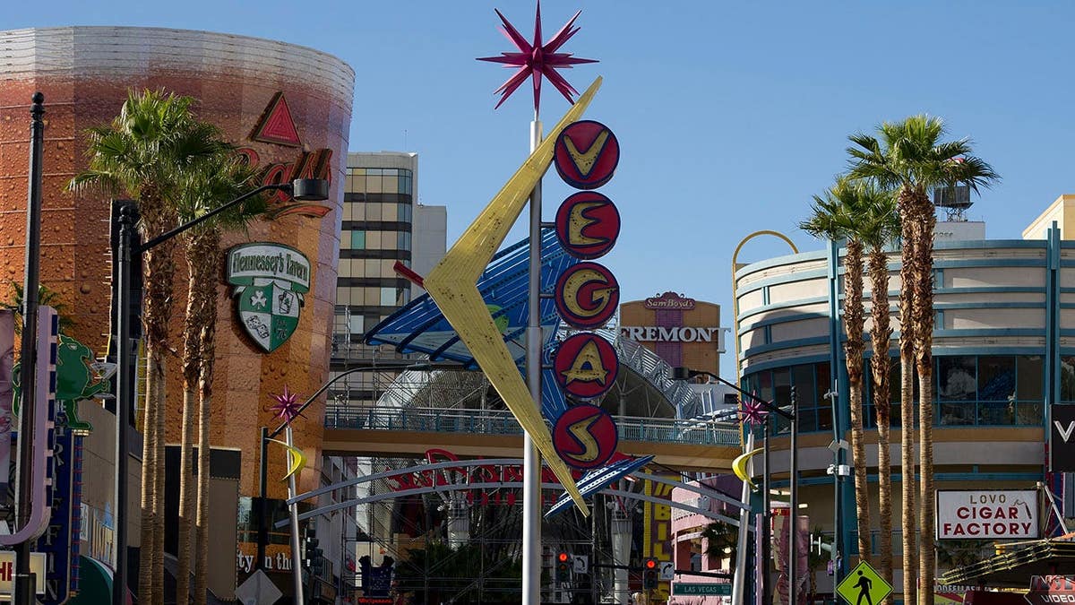 Pedestrian walks across Fremont Street in downtown Las Vegas, Nevada.
