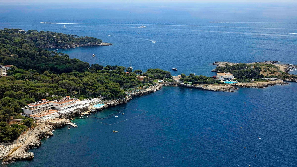Aerial view of the Peninsula of Antibes showing the Eden Roc hotel and waterfront villas.