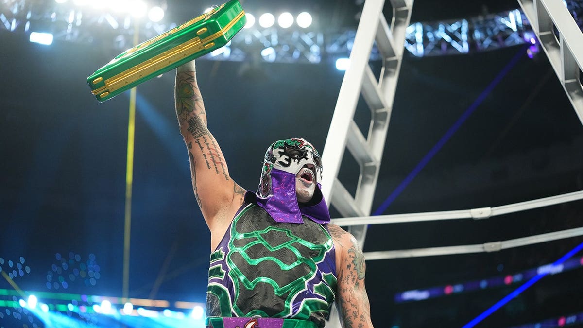 Penta celebrates his win in a wrestling ring at First Horizon Center.