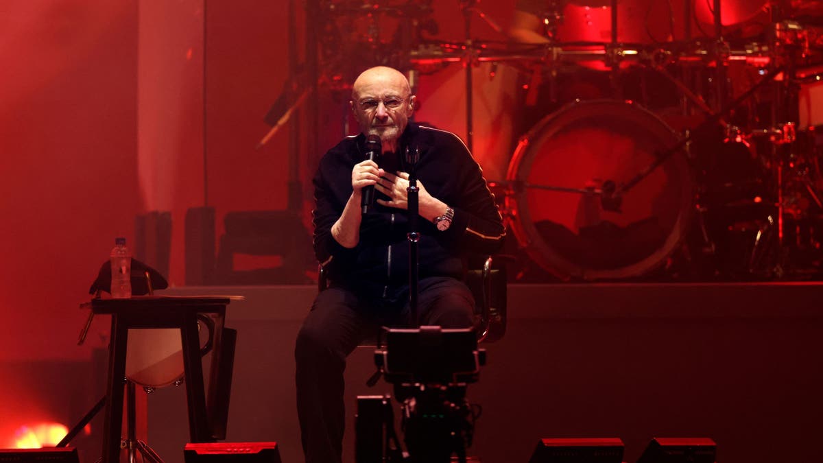 Phil Collins performs on stage during Genesis concert at Paris La Defense Arena.
