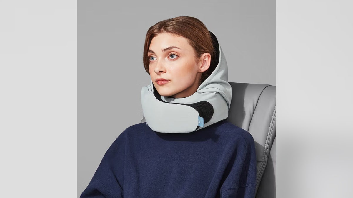 Travelers can block out the world with this travel pillow.