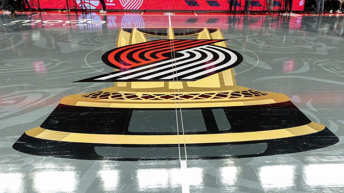 NBA Cup logo painted on court during Sacramento Kings vs. Portland Trail Blazers game.