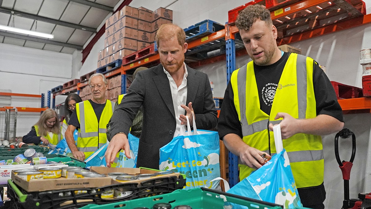 Prince Harry at a Nottingham Hubb inspecting materials.