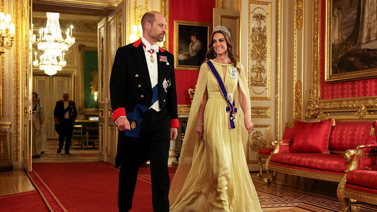 Prince William and Catherine, Princess of Wales, arrive at Windsor Castle for a state banquet.