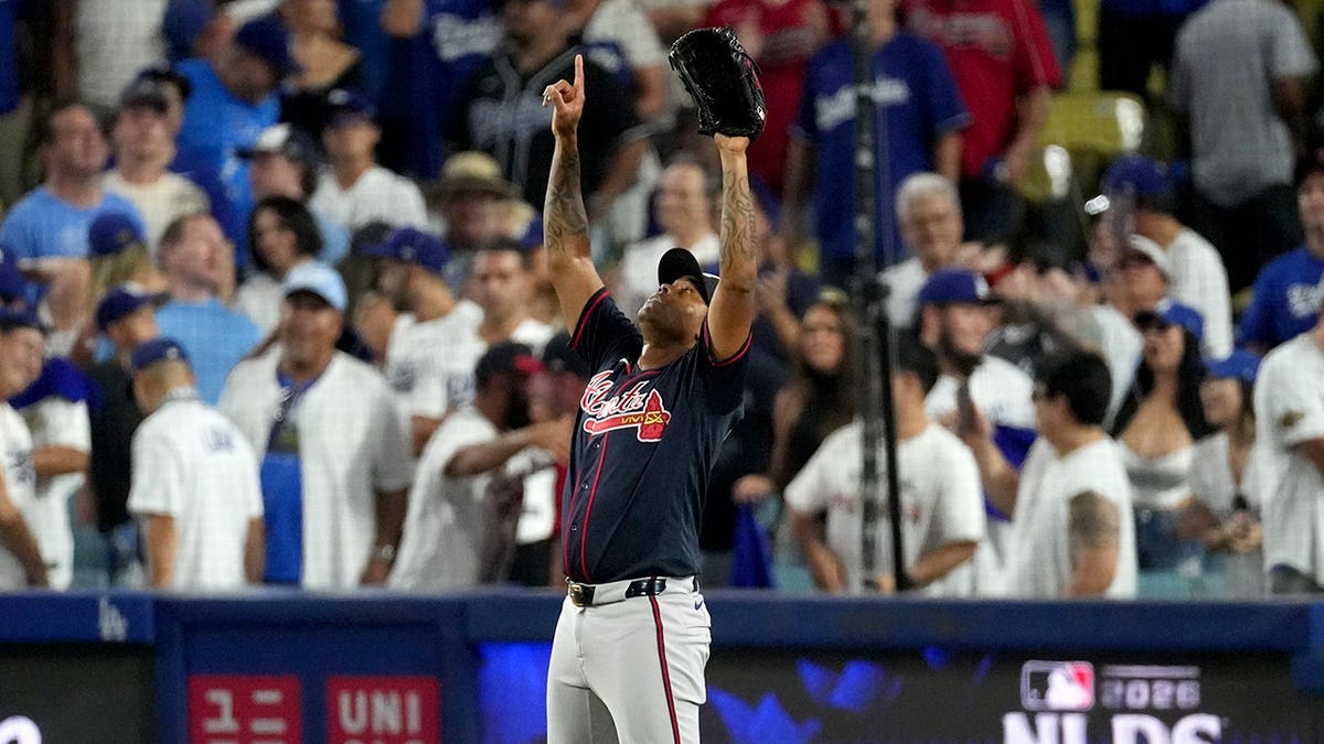 Raisel Iglesias celebrates after the Braves defeated the Dodgers in Los Angeles.