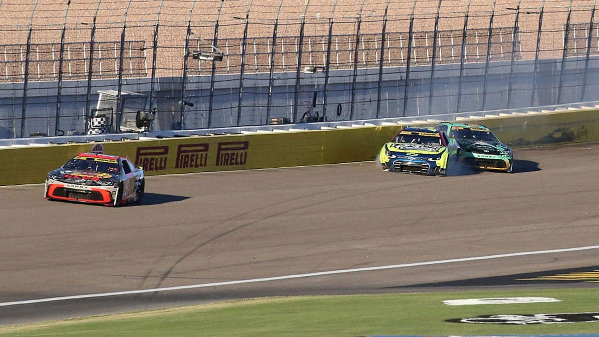 Tyler Reddick and Kyle Larson tangle exiting turn 4 during the South Point 400 NASCAR race.