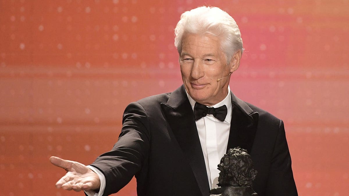 Richard Gere receives the International Award onstage at the Goya Awards ceremony.