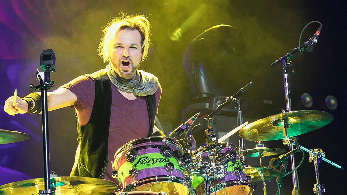 Rikki Rockett performs drums at Oracle Arena in Oakland, Calif.