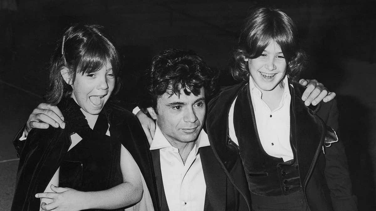 Robert Blake poses with his children Delinah and Noah at the Emmy Awards.