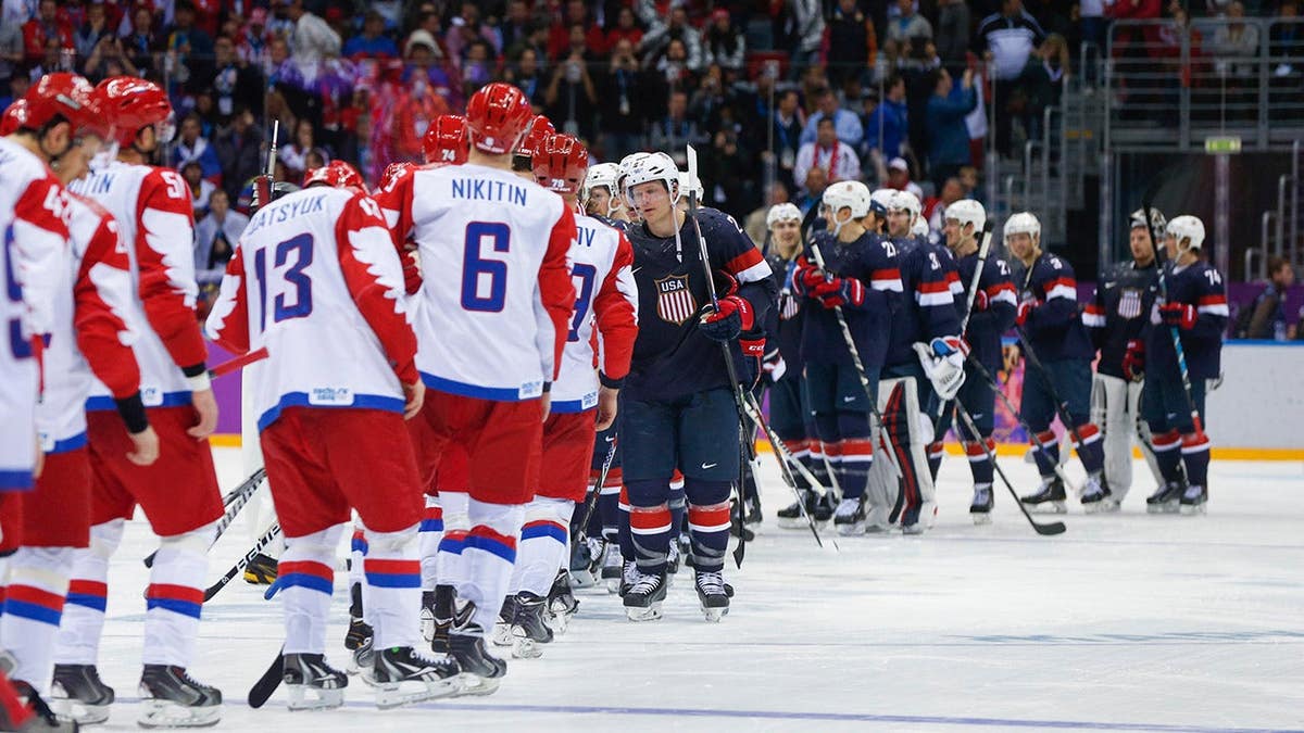 Team USA and Team Russia face off during men's ice hockey preliminary round.