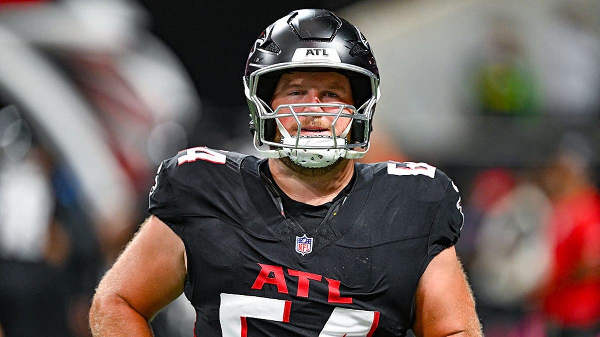 Ryan Neuzil warms up at Mercedes-Benz Stadium in Atlanta.