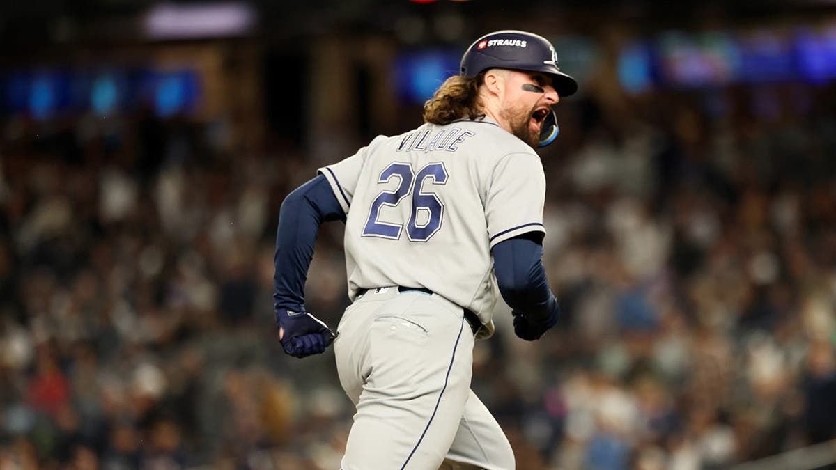 Ryan Vilade rounds the bases after hitting a solo home run at Yankee Stadium.