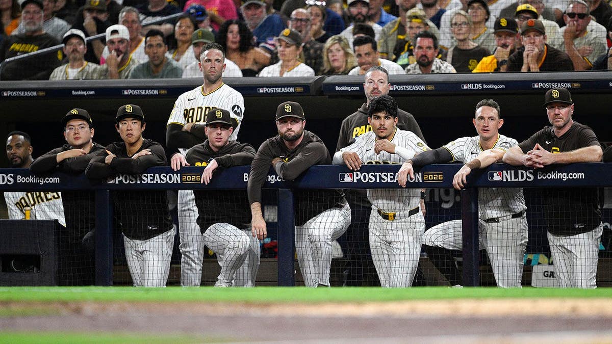 San Diego Padres players look on from the dugout at Petco Park.