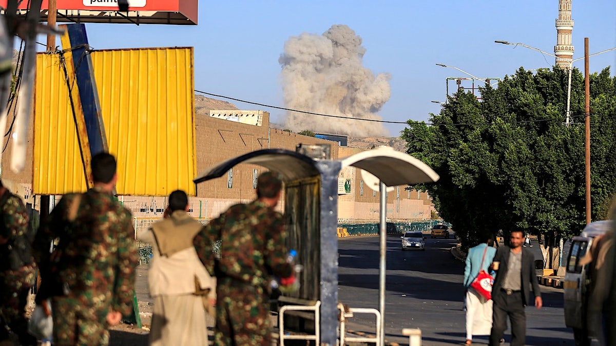 A plume of smoke rises during a reported airstrike by the Saudi-led coalition
