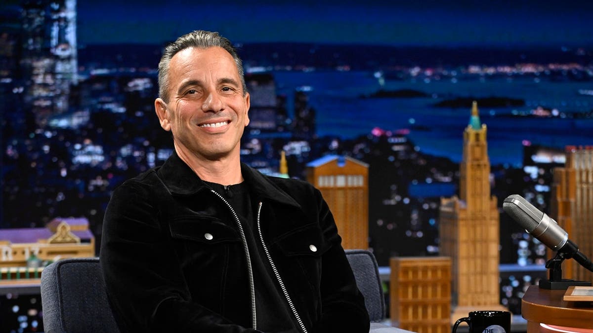 Sebastian Maniscalco speaks during an interview on a talk show set.