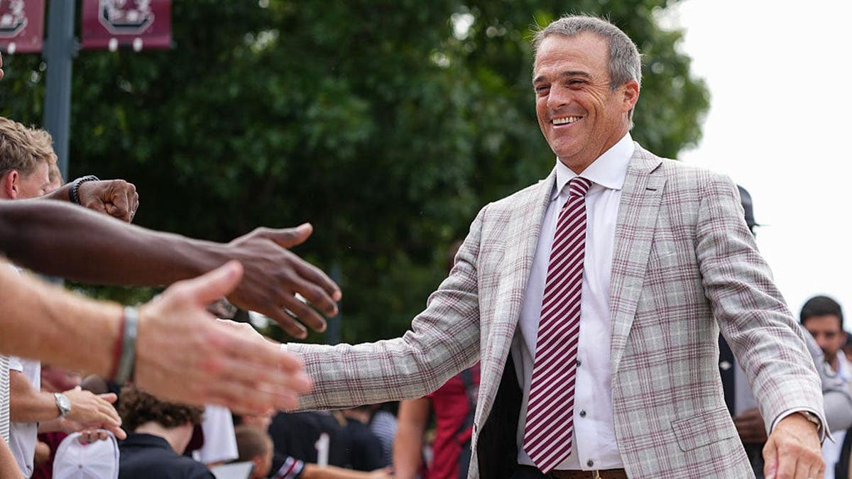 Shane Beamer greets fans before a game at Williams-Brice Stadium.