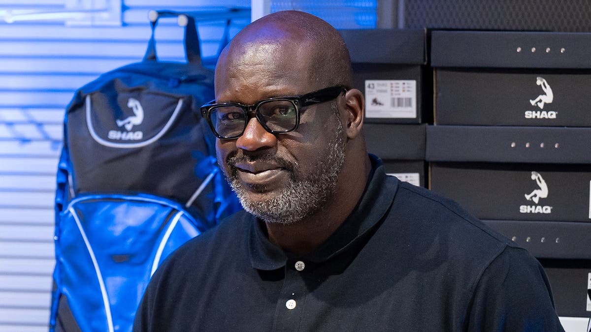 Shaquille O'Neal meets with fans inside a shopping mall.