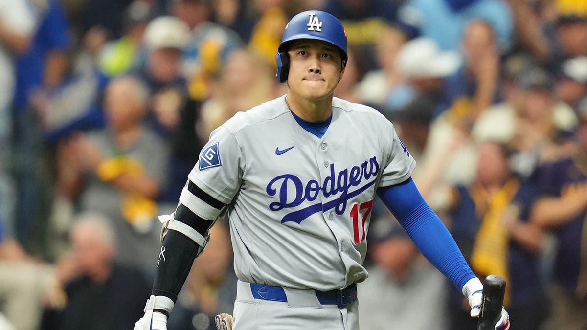 Shohei Ohtani walks to the dugout after striking out at American Family Field.