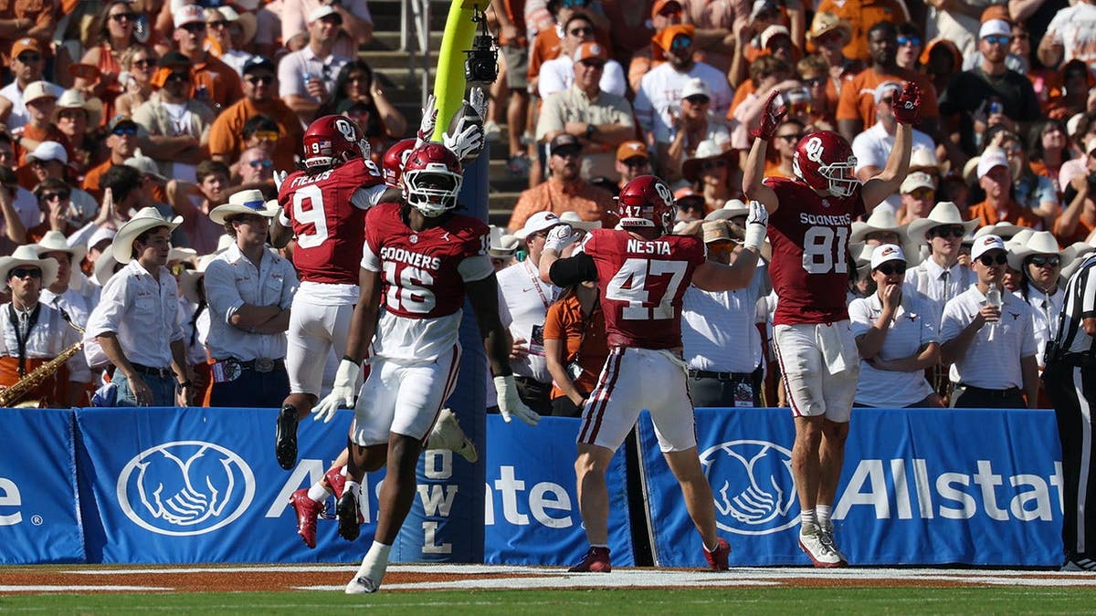 Dakoda Fields celebrates after recovering a blocked punt for a touchdown.