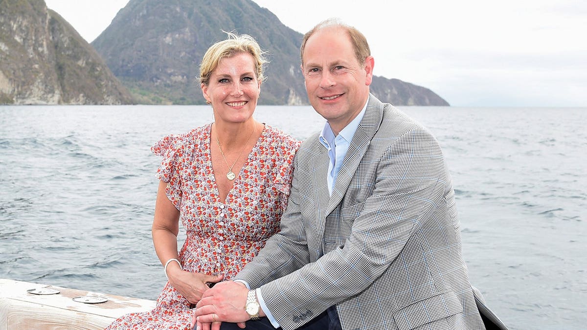Sophie, Countess of Wessex, and Prince Edward, Earl of Wessex, depart a boat in Soufriere.