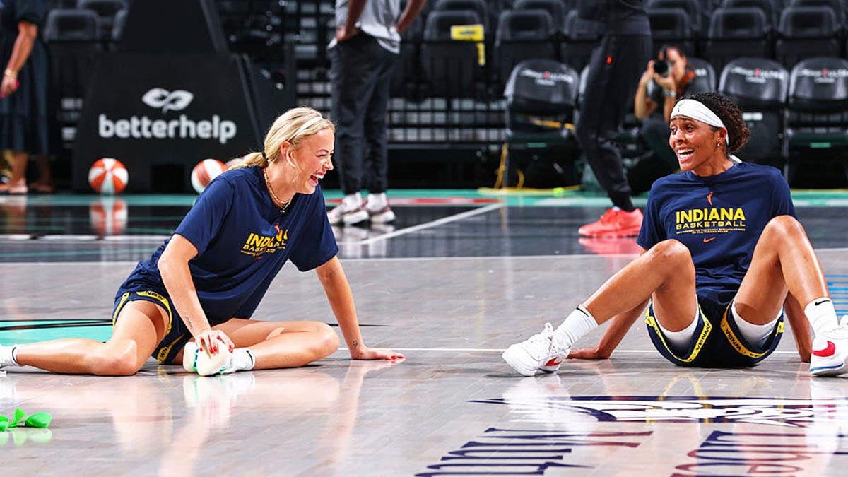 Sophie Cunningham and Sydney Colson warm up before a WNBA game.