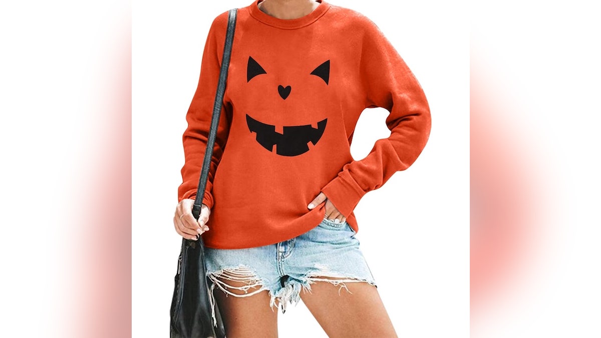 Throw on this adorable pumpkin sweatshirt and call it a costume.